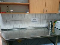 fragment wymienionej zabudowy kuchennej z informacją o dofinansowaniu projektu